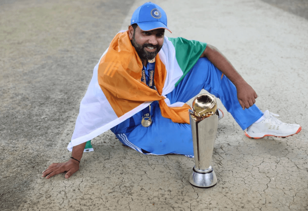 Rohit Sharma poses with the Champions Trophy in Dubai